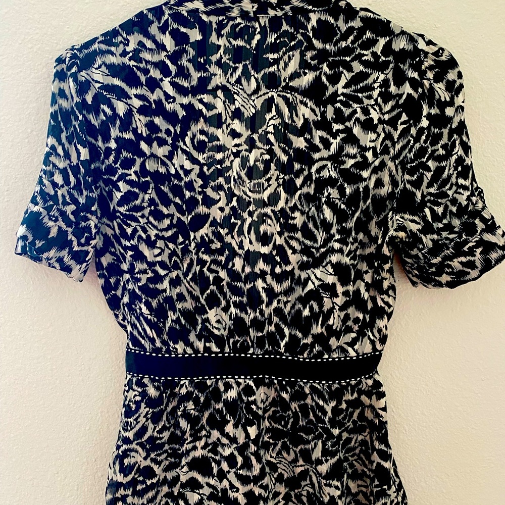 Women’s BCBG size S top. It is black print